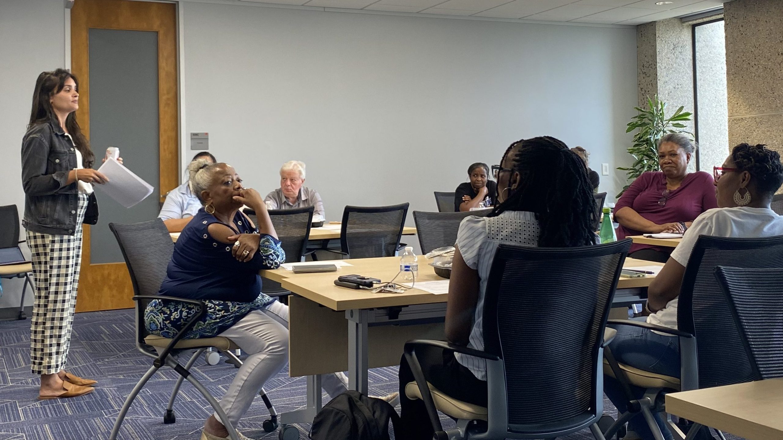 Eliza Mathew speaks to Phase 2 members at their July meeting.