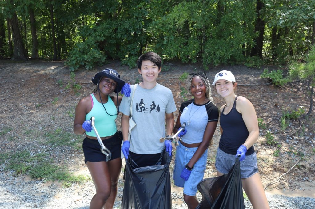Four BUILD participants pose together while working