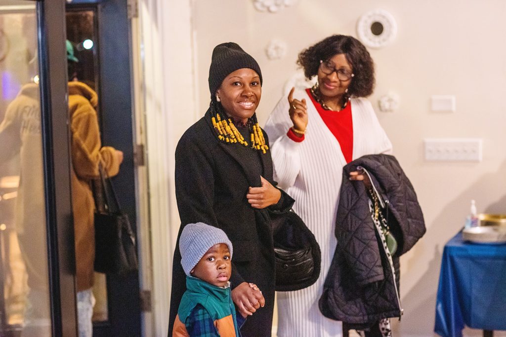 Club members smile as they enter the celebration