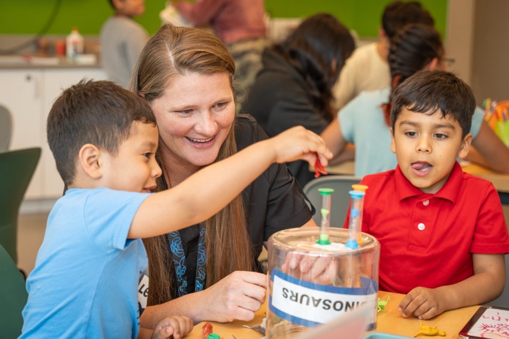 Alverson and students play together.