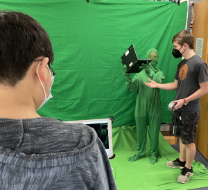 kids working in front of green screen